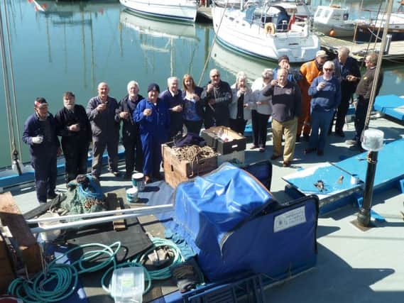Crew from the Reaper at the Scottish Fisheries Museum celebrate the Queen's 90th birthday