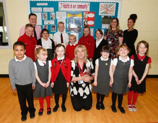 Fair Isle Primary pupils with head teacher Rae Walker and staff Steven Hutcheson, Lyndsay Liddell and Christina Daher  have become the first school in Britain to achieve the Lighthouse Award for the 'Leader in Me' programme incorporating the 7 Habits of Effective People