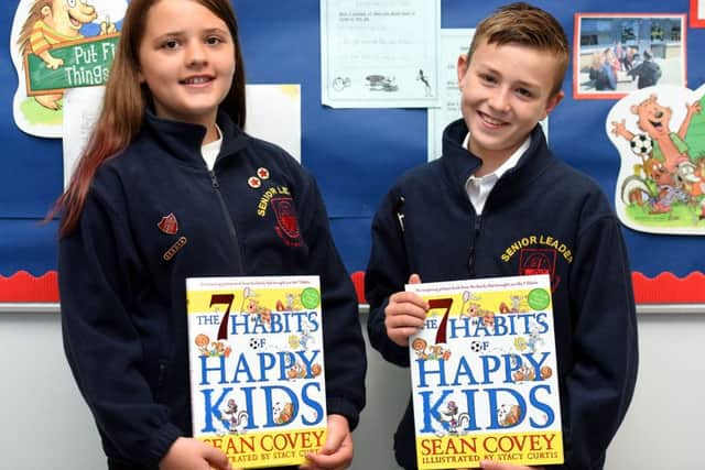 Lucy Scott and Jaye Binnington, last year's head girl and boy with their 7 Steps books