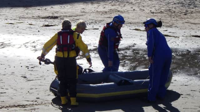The rescued dinghy is brought ashore
