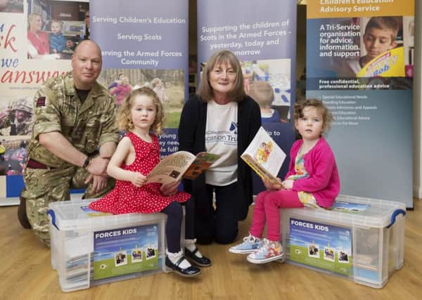 The Royal Caledonian Education Trust (RCET). 
Early Years Resources Project at Leuchars Community Centre. 
L to R, Ian Folks (71 Engineer Regiment), Isabella McGregor (3yrs old), Moira Leslie (RCET) and Eswen Smith (3 yrs old).