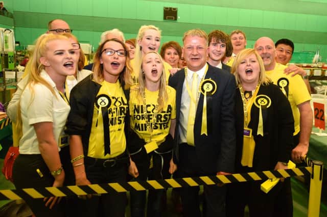 The SNP team celebrate David Torrance's victory.