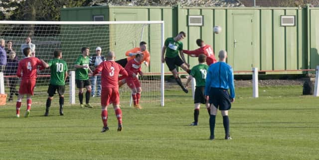 Gregor Anderson clears a Broughty corner kick