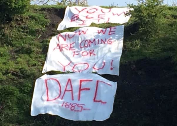 Banners created by Dunfermline Athletic fans have appeared overnight
