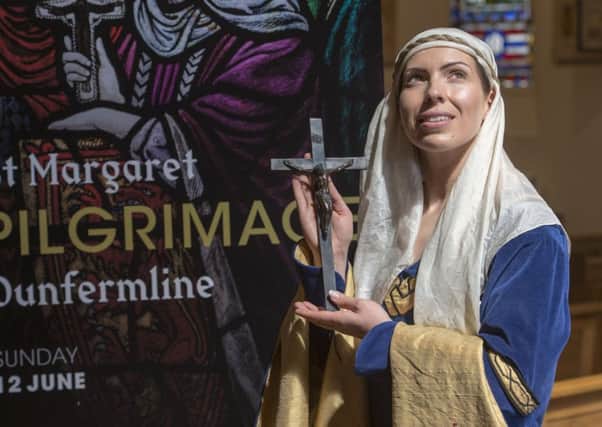 St Margaret of Scotland ( played by Fife actress Katie Milne) helped unveil the publicity poster at St Margaret's Chapel in Edinburgh.  Picture Ian Rutherford