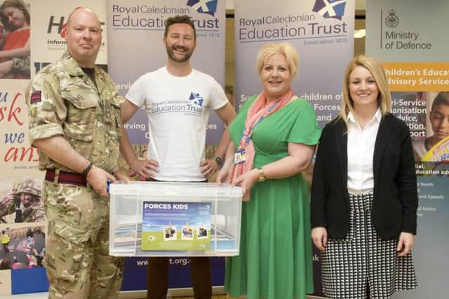 Lt Col Ian Foulkes, Matthew Middleton, Victoria Wooton, Donna McCarney at the launch of the Forces Kids boxes at Leuchars Station.