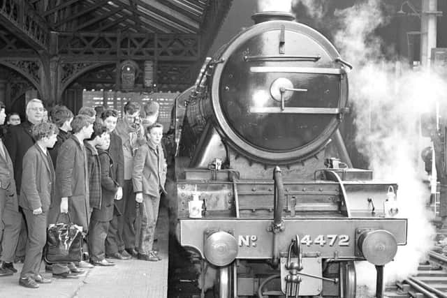 Trainspotters gather to see the Flying Scotsman when she leaves Waverley station in Edinburgh for Aberdeen in 1964.