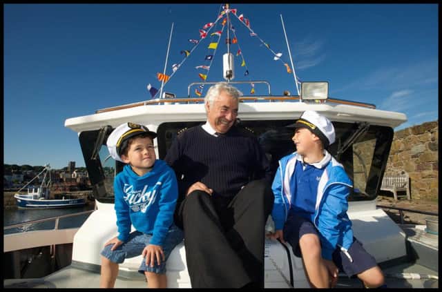 Colin Aston, of Seafari Adventures, with young sailors Laird and Radleigh Wharton aboard the Forth Ferry. PicL Rob McDougall.
