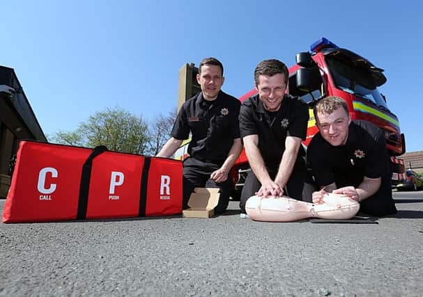 From left with the CPR kit - Gwyn Edwards, Andrew Paul and John McTacTaggart.