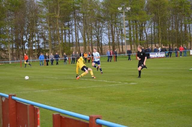 Ross Mutch scoring the first of his hat trick against Pittenweem.