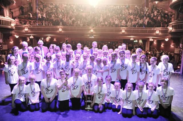 The winning St Marie's RC choir are joined by their coaches, the competiton judges and Provost of Fife, Jim Leishman onstage at the Alhambra Theatre (Pic (c) David Wardle)