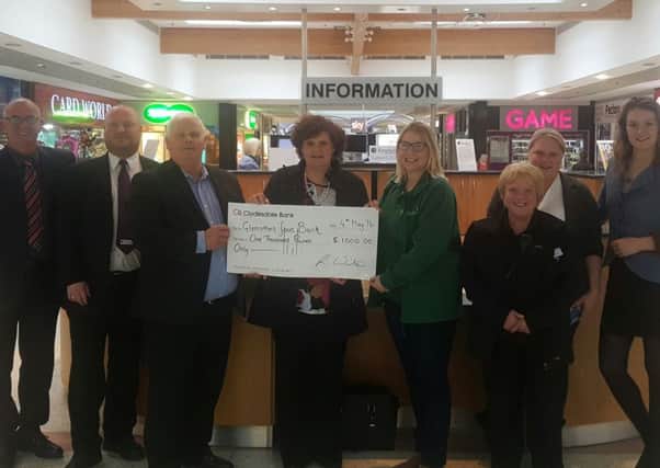 Robert Winter, manager at Kingdom Shopping Centre, presents the cheque to Lyndsay Clarke, Glenrothes Foodbank chair, and Jilly Guild, project manager. Also pictured are members of the centre management, security and housekeeping teams.