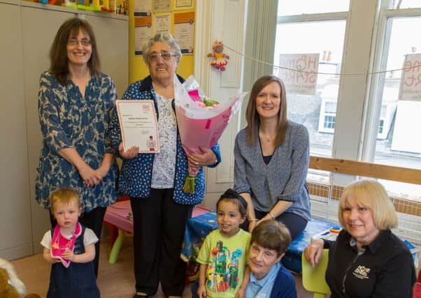 Stella (with flowers) with Mary McCouat, Jeanette Holmes, Eleanor Thomson, Mary Cormack and kids of Homestart Kirkcaldy. Picture: Steven Brown Photography.