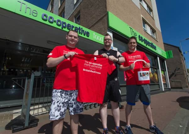 Alan Ward (22), Colin Currie (30) and Darren Phillips (32) are competing in the Black Rock Run for The British Red Cross. Picture: Steven Brown