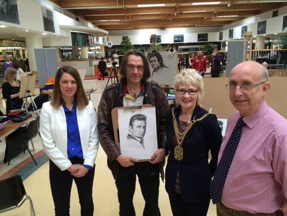Jenny Gilruth MSP and depute provost and councillor Kay Morrison with with of the artists from the day