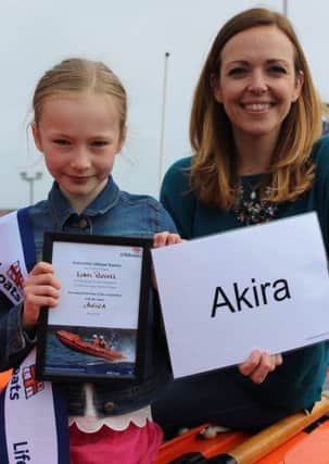 Eden Russell, who came up with the winning name of Akira for the new Anstruther Lifeboat, with actress Katrina Bryan.