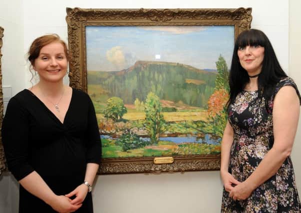 Lesley-Anne Lettice and Janice Crane, curators at Fife Cultural Trust enjoying Summer Landscape by J Y Macgregor