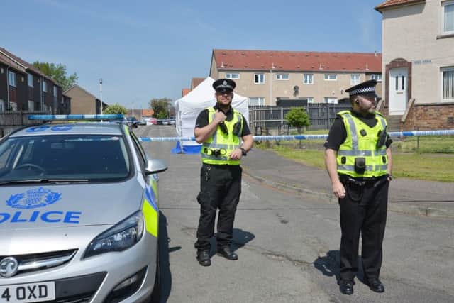 Police at the cordoned off area in Tweed Avenue (Pic by George McLuskie)