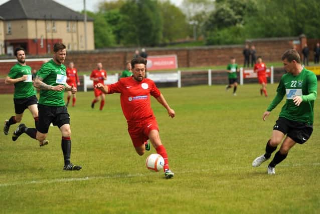 The Tayport defence scrambles back. Picture Roberto Cavieres.