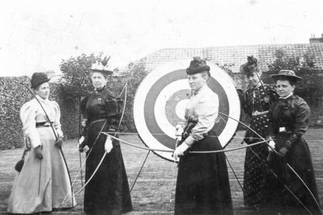 Members of the St Andrews Ladies' Archery Club on the lawn behind United College in 1895.