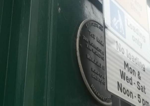 New parking signs in pedestrianised zone of High street, Kirkcaldy - covering up Civic Socierty plaque to Pet Marjorie