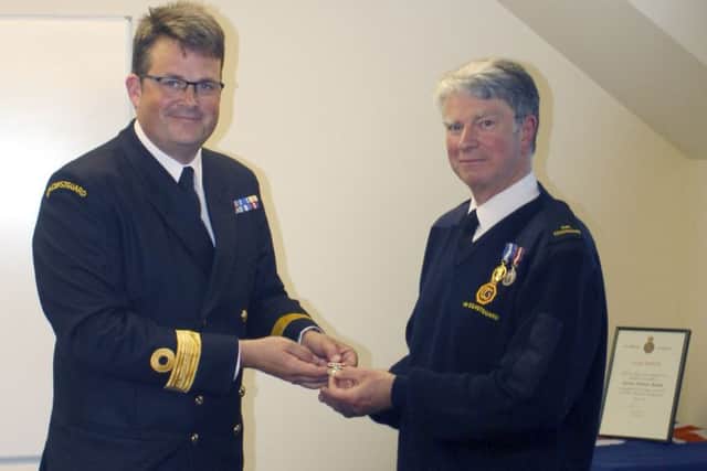 Charlie Ball, head of Coastal Operations at HM Coastguard presented Martin Barkla with Long Service and Good Conduct Medal on Tuesday, June 14 for 30 years service with St Andrews Coastguard.