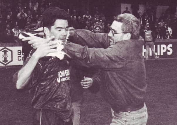 Peter Hetherston is embraced by a fan after winning First Division title in  the 1992-93 season