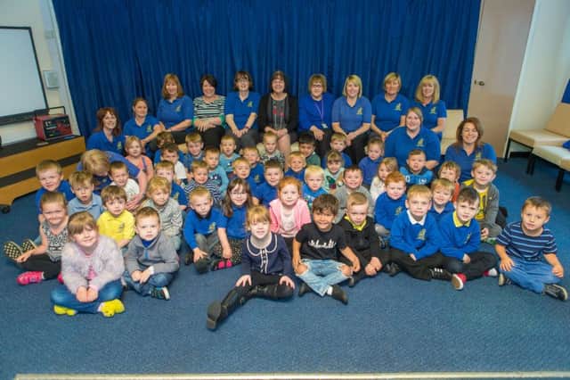 Paxton Nursery headteacher Heather Pozzi with her staff and some of the children. Picture by Steven Brown Photography.