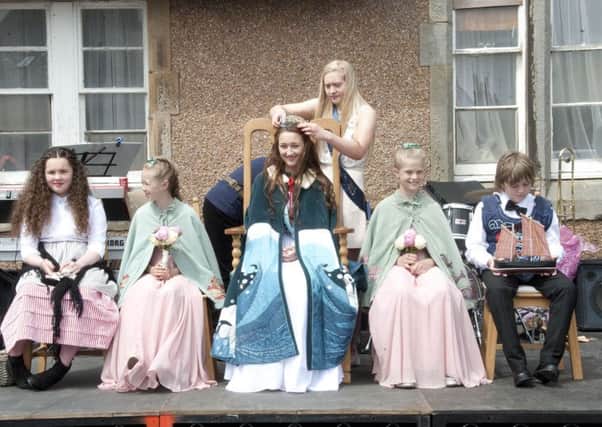 Sea Queen Rachel Leitch, pictured with her attendants Jocie Chater and Blythe Taylor and page boy Sonny Montador, is crowned by her predecessor Danielle Marr. Also pictured is St Monans Fisher Lass Emily Kelly, left. (Picture: Peter Adamson)