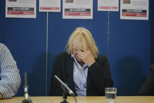 Margaret Adie breaks down at the press conference