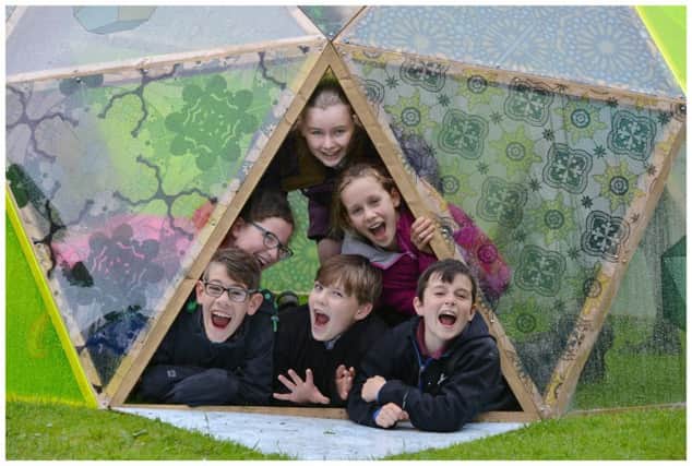 Children from St Columba's Primary School in Cupar explore the Sun Dome, an installation by artist Mike Inglis, which is situated in Haugh Park
