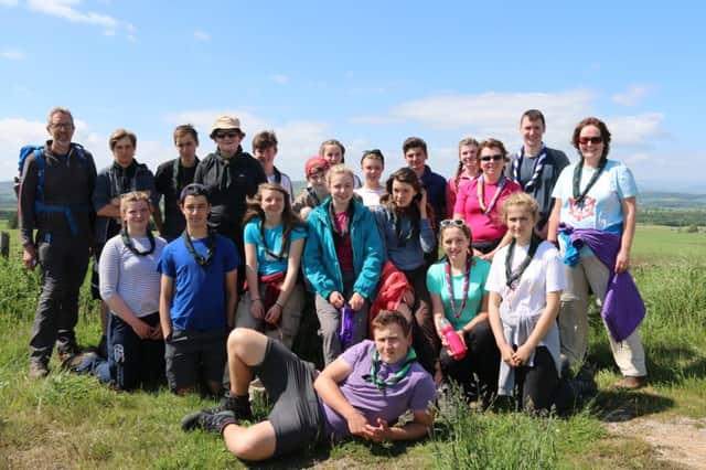 St Anderws Explorer Scouts are heading to Switzerland. Pictured at a recent training camp:  Carrot Hill Photo (left to right, front to back) Rory Johnsone Eve Duncan, Jack Parmar, Charne Janse van Rensburg, Sasa Tough, Rosa Guild, Brynja Duthie and Abby Johnsone. John Duthie, Benjamin Goad, Ryan McGlade, Alex Binyon, Lyall Constable, Lachlan Tough, Rebecca McCowan, Beth McCallum, Craig Campbell, Zoe Duncan, Pam Duncan, Cameron Whitelaw and Charmaine Duthie.