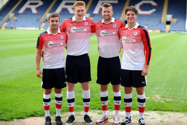 The players model the full kit (from left) Lewis Vaughan, David Bates, Iain Davidson and Ross Callachan. Credit - FPA  -
