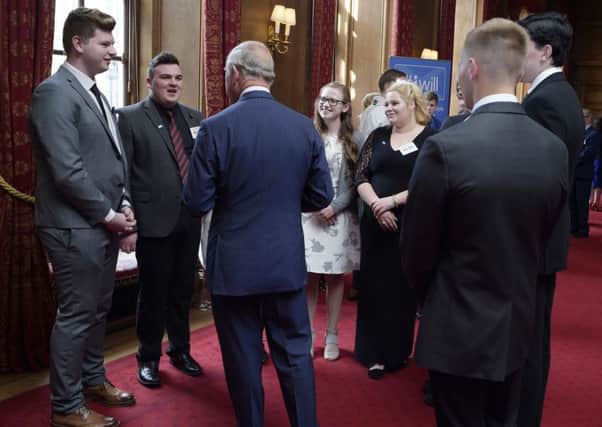 Morgan Morris (second left) speaks to HRH Prince Charles (picture by Sandy Young)