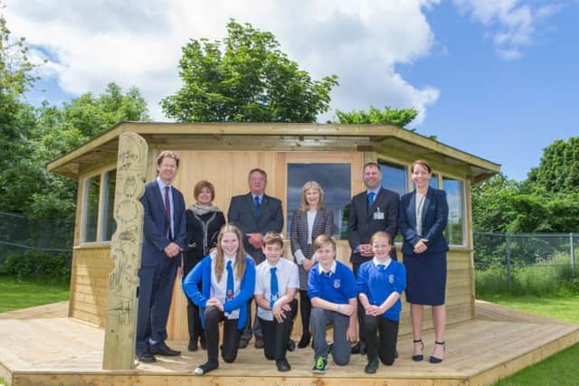 The official opening of St Marie's PS's new outdoor classroom; Pictured: (Left) William Sloan, Mariam Farquharson, Les Soper, Mary Caldwell, Patrick Callaghan and Jacqueline Crawford. (Front) Kirsty Fowler, Bryonny McCormick, Daniel Martin and Joshua Saunders