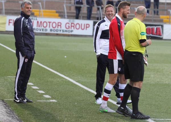 Raith boss Gary Locke, assistant Darren Jackson and midfielder Iain Davidson share a laugh with referee Stephen Finnie in the midweek friendly defeat at Forfar. Pic: Chris Coutts