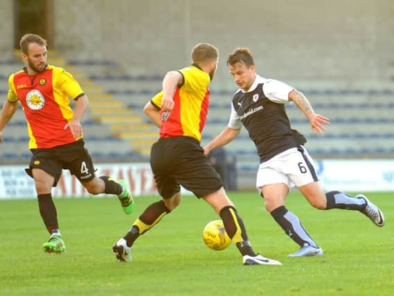 Kyle Benedictus weaves his way through the Partick midfield. Picture by FPA.