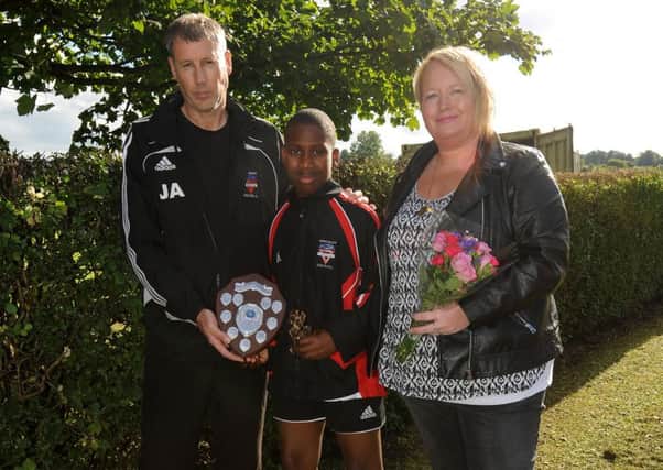 Andrew Boateng receives trophy in memory of Alysha Balfour, with  Colts treasurer John Anderson and Alysha's mother Karen Brady (FPA Walter Neilson)