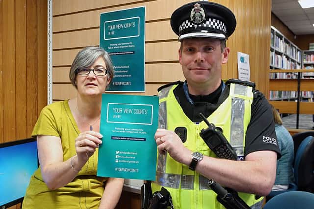 Libraries service development team leader Yvonne Melville with Chief Inspector Adrian Annandale.