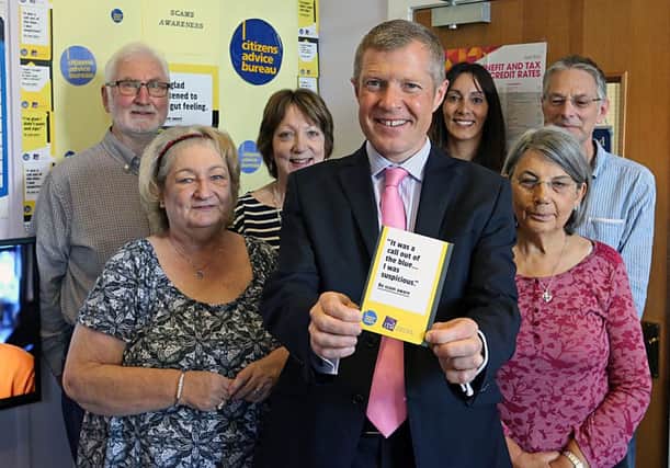 Local MSP Willie Rennie (front) at the launch, with, from left - volunteer Bernard O'Donnell, bureau manager Irene Martin, volunteer Ann Adamson, CARF operations manager Myrian Lazo and volunteers Cynthia Greenweed and Richard Wigfield.