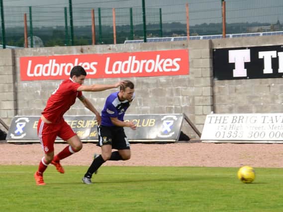 Kevin Smith makes a break down the line during the weekend's defeat to Aberdeen.