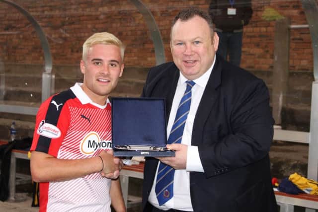 Raith's Lewis Vaughan receives Man of the Match award from Cove Rangers Chairman Keith Moorhouse. Pic: Richard Forbes