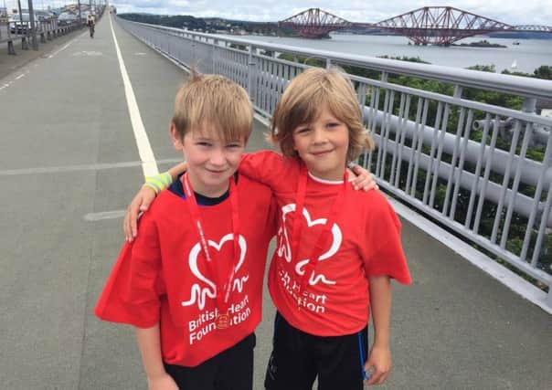 Jack Farmer (9) (left) and Declan McDaid (8) completed a 6K walk over the Forth Road Bridge and back on August 30.