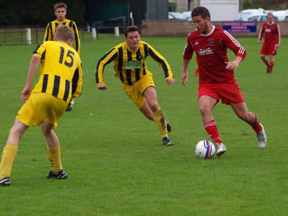 Greig Park Rangers - in red - were given a tough test.