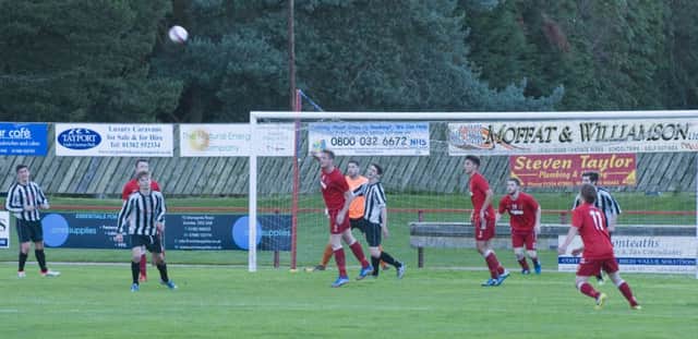 Scott McDowell clears for Tayport during the midweek 1-1 friendly draw with Jeanfield. Picture by R Nicoll.