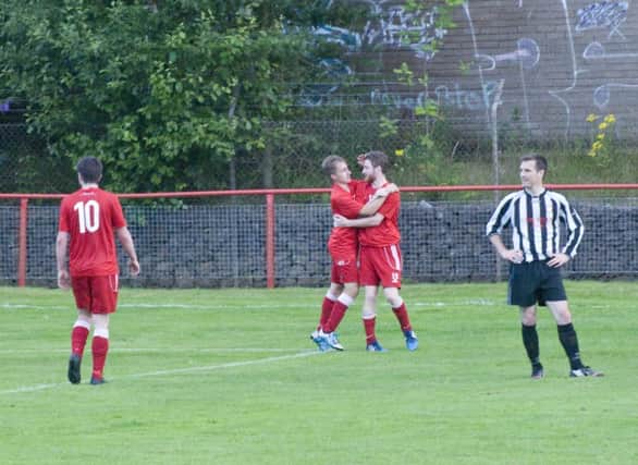 Liam Ross congratulates Dale Reid after his opener for Tayport