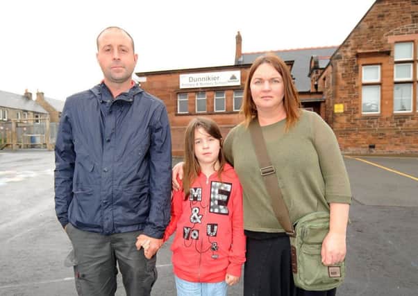 Lisa with her partner Stuart and their daughter Jo outside Dunnikier PS. Pic: FPA.