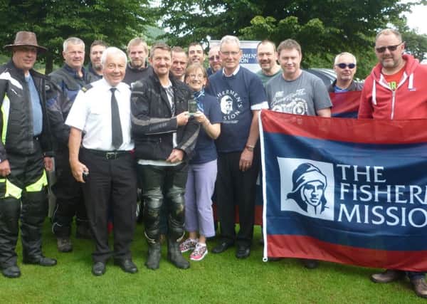Peter Donald, Rhona Grant and Allan Burr from the Fishermens Mission present Scott Jones and his friends with the award for the National Fundraisers of the Year.