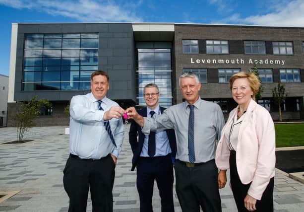 Martin Cooper of BAM hands over the keys to Cllr Tom Adams, Chair of Levenmouth Area Committee and Depute Leader of Fife Council Lesley Laird