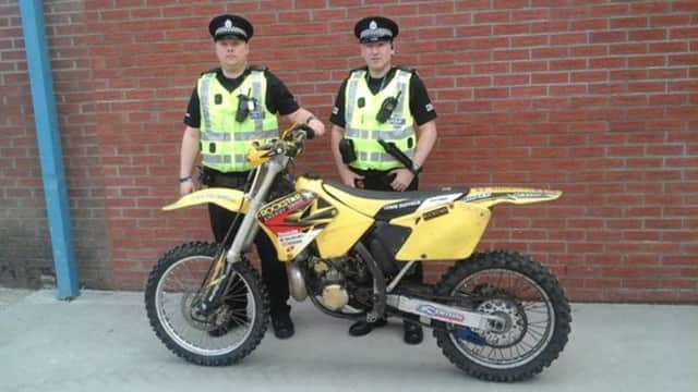 Police in Kirkcaldy with one of the motorbikes seized as part of Operation Fireblade